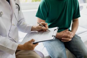 A doctor talking to a patient about early warning signs of prostate cancer